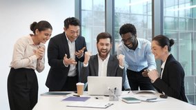 Team business people celebrate success and achievement look at laptop computer Group professional teamwork at modern office partnership received good news happy employees celebration corporate victory - Powered by Shutterstock - Get 15% off with code: PIKWIZARD15