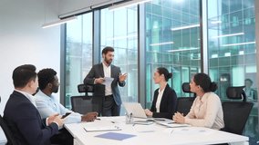 Group of business people meeting in office. Diverse corporate team of professionals in suits discussing strategy or startup. Brainstorming briefing co-workers colleagues communicate at conference  - Powered by Shutterstock - Get 15% off with code: PIKWIZARD15