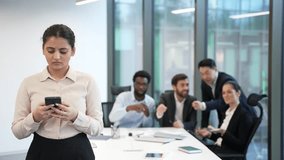 Harassment bullying in office at workplace. Coworkers employees group man and woman Whispering Behind Back colleagues gossiping behind young specialist worker workmate bullying problem at work indoor - Powered by Shutterstock - Get 15% off with code: PIKWIZARD15