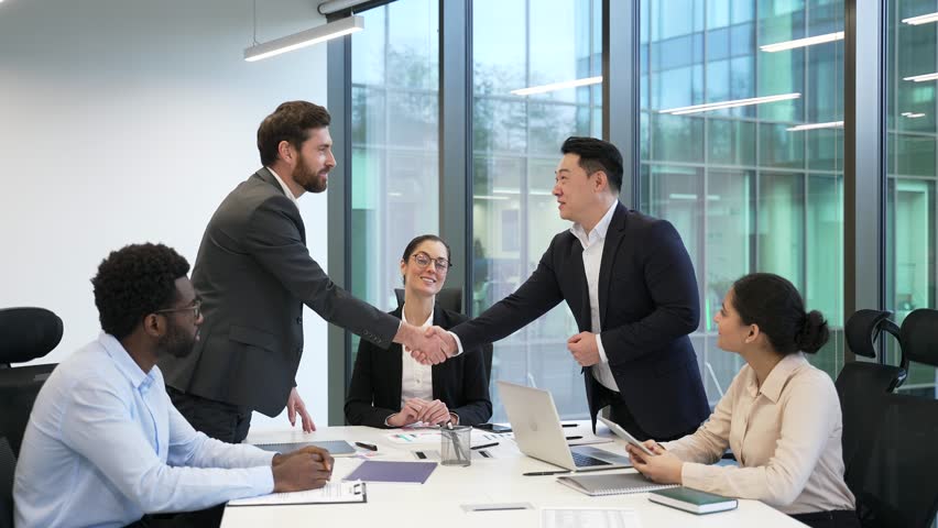 Group businesspeople make agreement Ending team meeting decision and profitable deal, finish planning cooperation shake hands accomplish in conference room. Successful business negotiations handshake