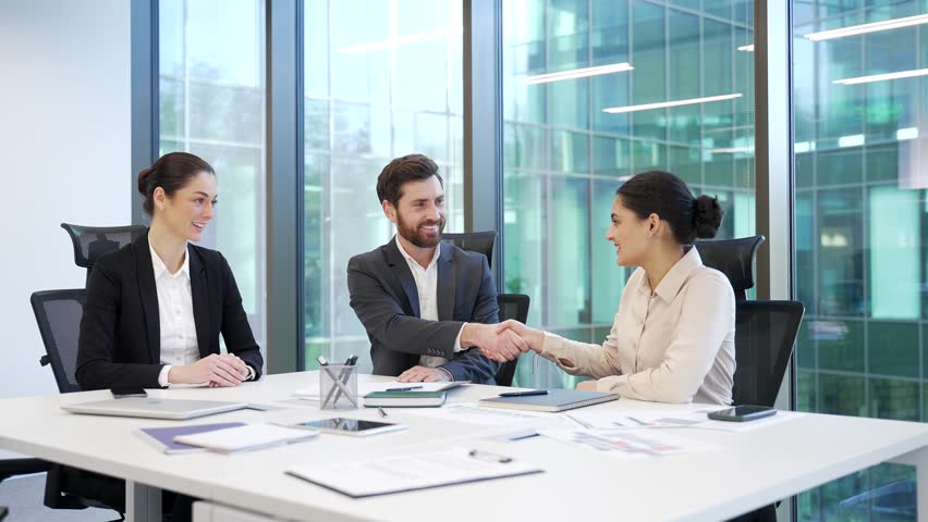 Job interview process HR managers listen applicant. Group of young professional business people take part in group meeting in boardroom, talking to client, negotiate in office hiring young specialist 