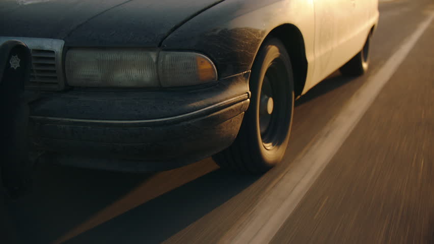 Close up shot of a tire on a police car during a chase