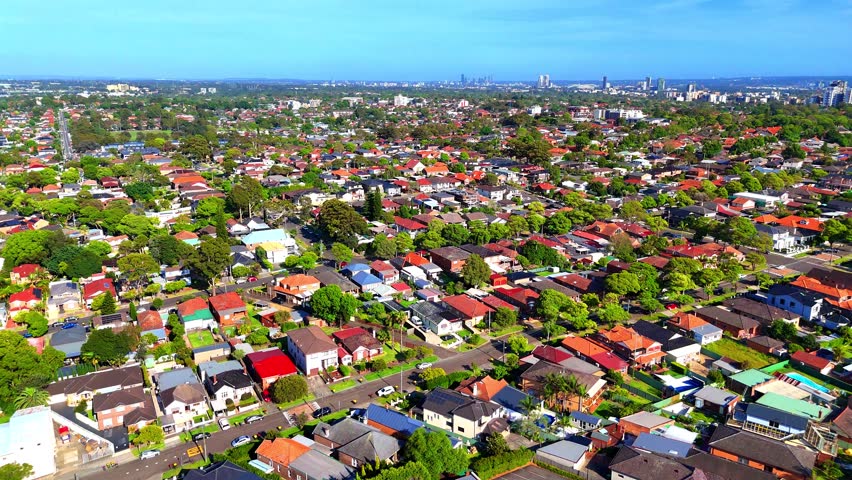 Panoramic aerial 4K Video view of western Sydney Suburbs of Canterbury Burwood Ashfield Marrickville Campsie Burwood with Houses roads and parks in Sydney New South Wales NSW Australia