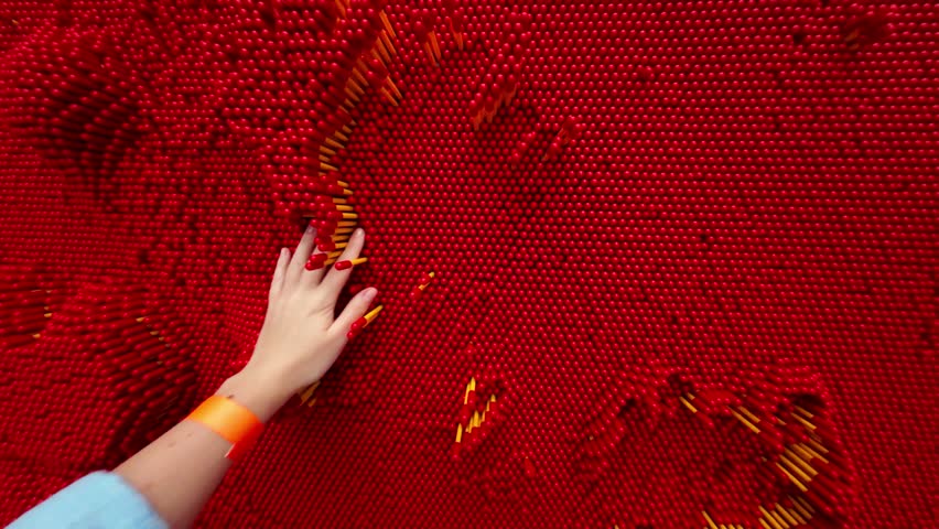 Three d cloning panel.Hand makes cloned print in red panel for pin art. Tactile Senses and Sensations Device.Learning and Science. Interesting and Fun Experiments with Tactile Sensitivity. 4k footage