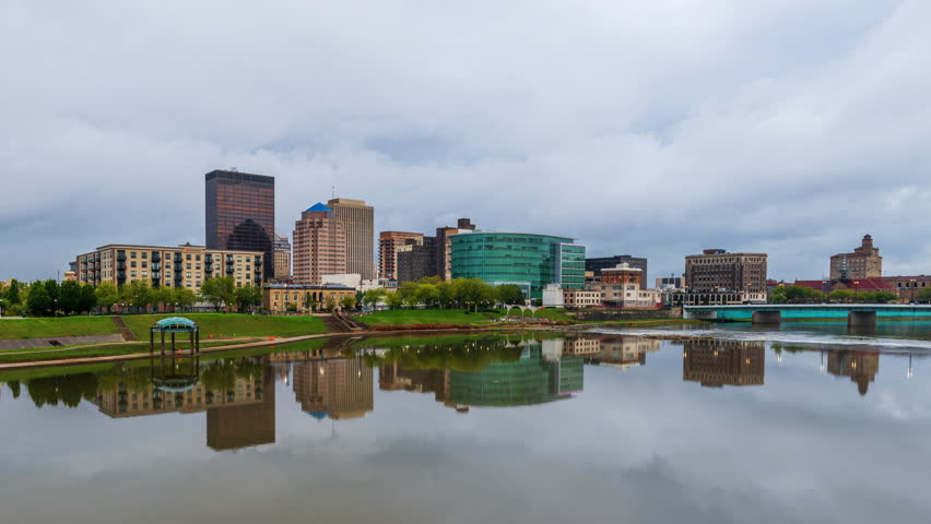 Dayton, Ohio, USA downtown city skyline from dusk till night on the Great Miami River.
