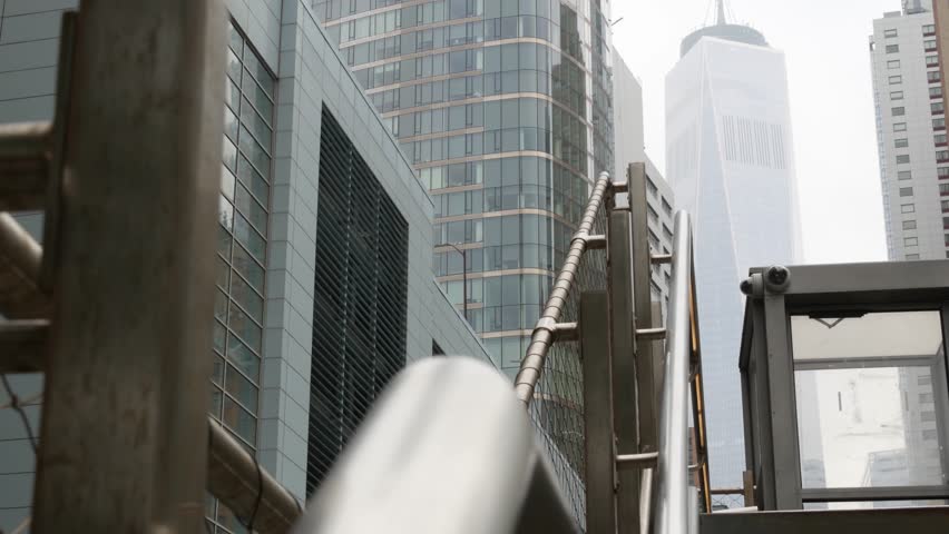 New York City Lower Manhattan, Downtown Financial District architecture, United States. One World Trade Center skyscraper building, USA. American urban street. WTC Freedom tower in NYC. Battery tunnel