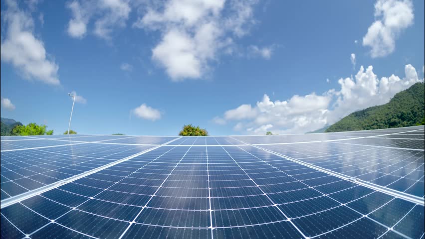 Solar panels with blue sky. Renewable energy concept, solar power, solar energy. Time lapse.