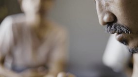 Close up of man having dinner together with woman while sitting at dining table. - Powered by Shutterstock - Get 15% off with code: PIKWIZARD15