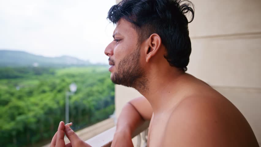 Adult Male in Depression Mood While Smoking, Distress Matured Man Fagging, Young boy reflecting stress expression, Standing and holding a cigarette at hand, On terrace, Miserable topless men crying