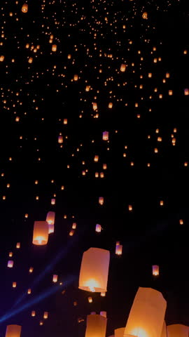 Tourist floating sky lanterns in Yi-Peng festival , Chiang Mai ,Thailand.