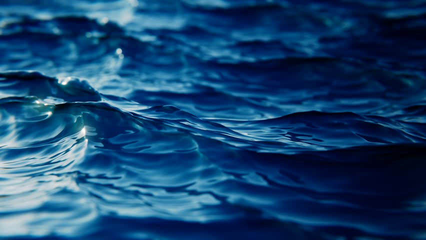 Close-up view of flickering ocean waves in slow motion, seamless loop background. Sunlights breathtaking beauty play on a wind wavy ocean surface. 3d render