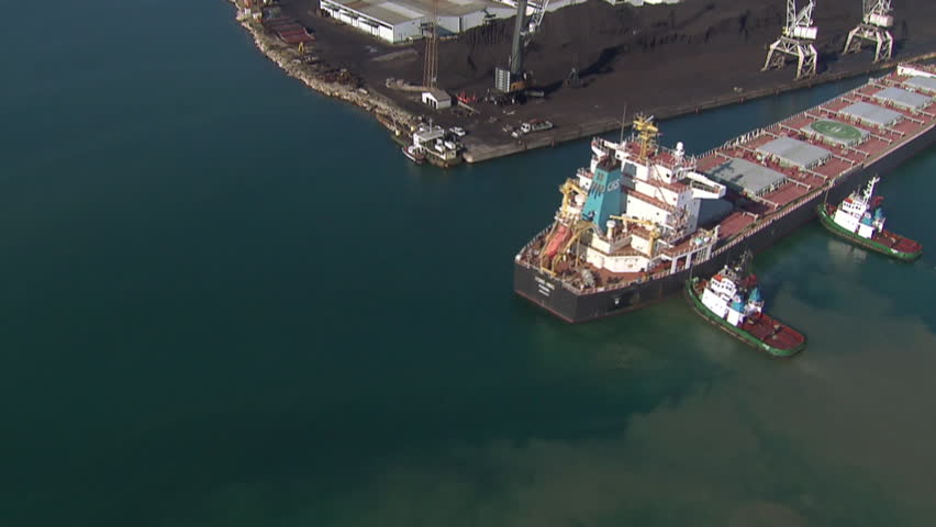 A tanker ship in a Cargo Port. Aerial shot.
