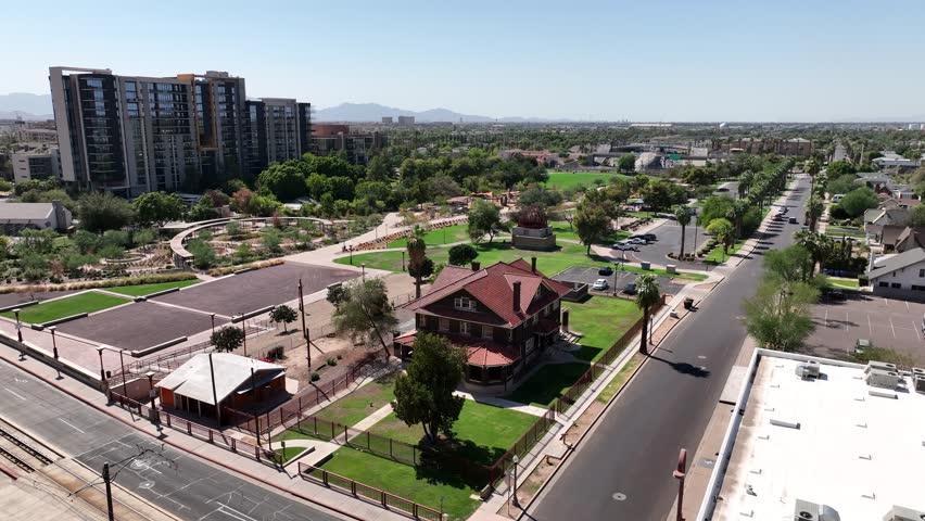Aerial view of modern cityscape with high-rise buildings and green park, Phoenix, United States.