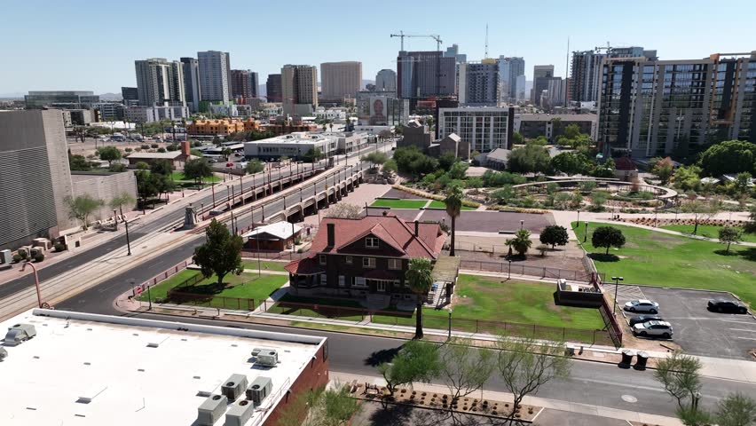 Aerial view of modern cityscape with high-rise buildings and green park, Phoenix, United States.