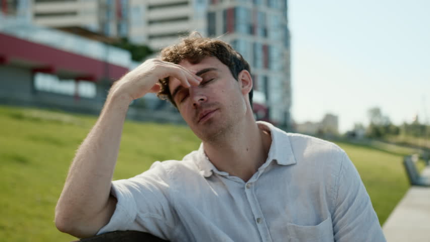 Tired Caucasian business man rubbing eyes male businessman city problem worker fatigued guy headache stressed discomfort loss bankrupt failure entrepreneur outside trouble unhealthy pain employee town