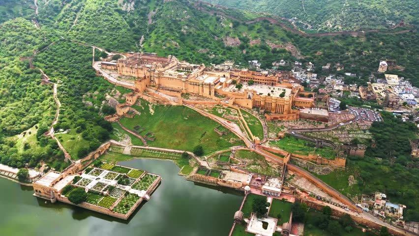 A grand Rajasthani fort stands tall, its intricate architecture and surrounding landscapes capturing timeless beauty