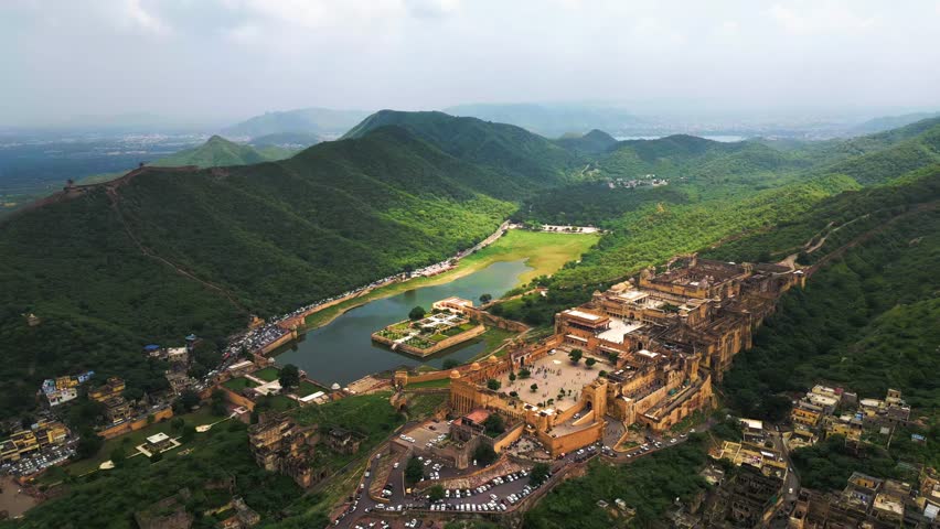 A grand Rajasthani fort stands tall, its intricate architecture and surrounding landscapes capturing timeless beauty