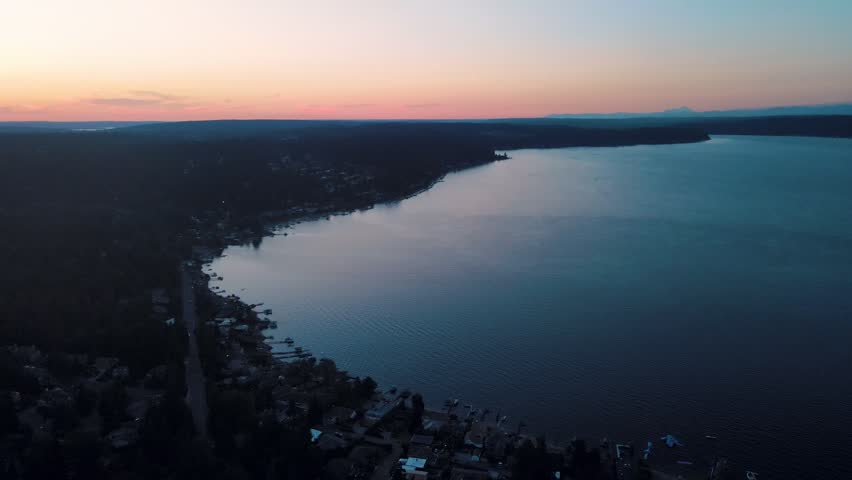 Aerial landscape of Lake Washington forest and mountains at sunset Bellevue suburb of Seattle WA USA