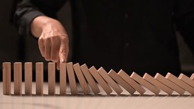 4K slow-motion dominoes cascading left to right, initiated by a finger touch under sunlight, symbolizing risk management and opportunity.
 - Powered by Shutterstock - Get 15% off with code: PIKWIZARD15