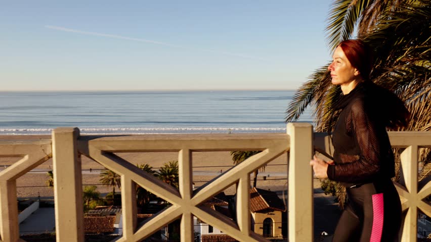 62 year old woman getting her exercise at the beach in Santa Monica California.