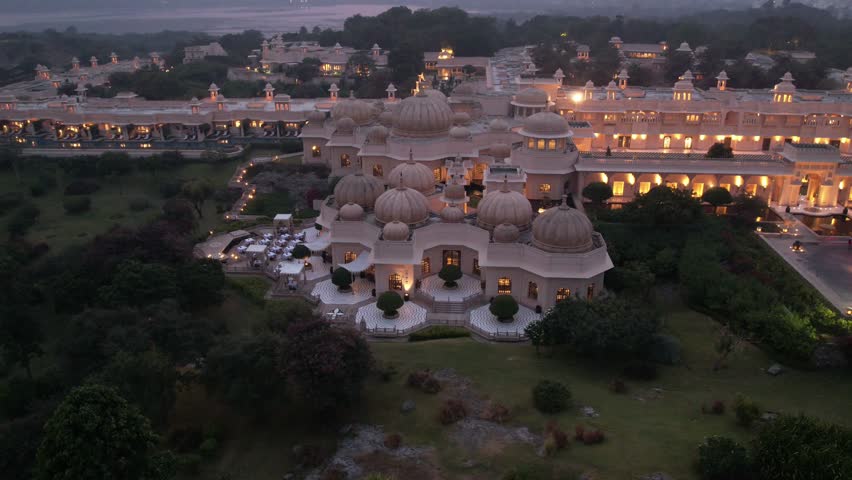 A grand Rajasthani fort stands tall, its intricate architecture and surrounding landscapes capturing timeless beauty