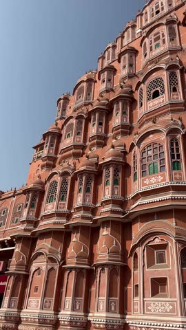 A grand Rajasthani fort stands tall, its intricate architecture and surrounding landscapes capturing timeless beauty