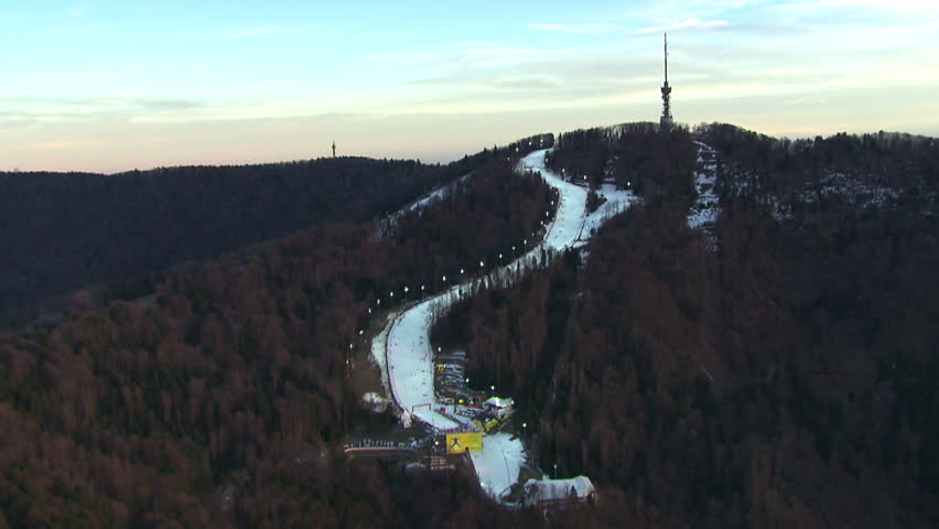 A ski track and TV tower on the top of the peak Sljeme. Aerial helicopter shot.
