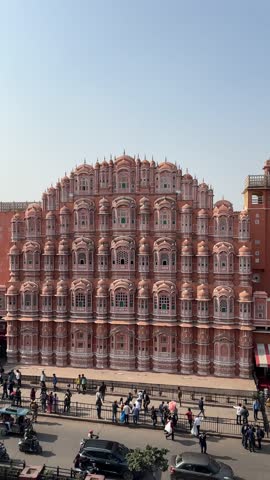 A grand Rajasthani fort stands tall, its intricate architecture and surrounding landscapes capturing timeless beauty