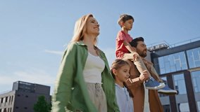 Happy generations walking sunshine park enjoying holiday. Small piggyback boy pointing finger talking with parents in field near house. Two brother sister kids spending weekend with mother and father  - Powered by Shutterstock - Get 15% off with code: PIKWIZARD15