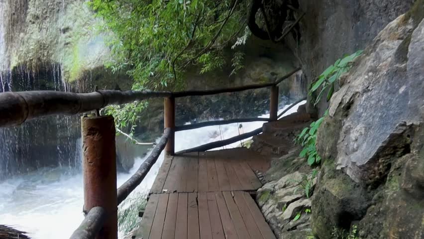 Beautiful waterfall pathway in lush nature with sound of flowing water