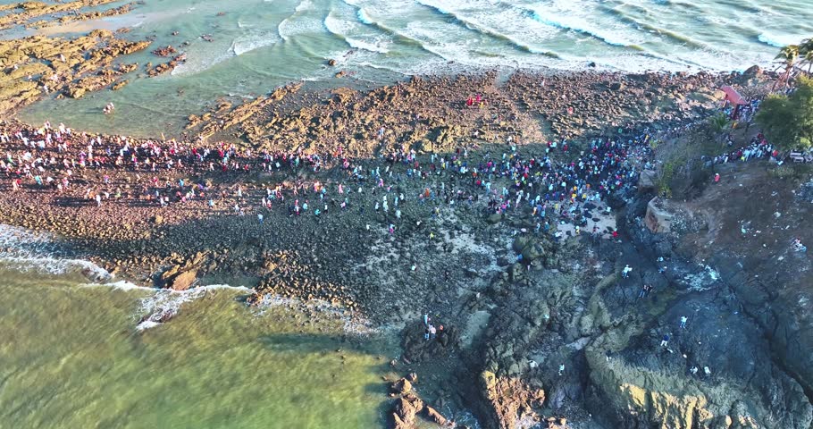 Aerial view of Hon Ba island in Vung Tau city, Vietnam. On full moon day of lunar calendar, when tide is low, people can walk across island to visit temple on mountain. Spiritual travel concept.
