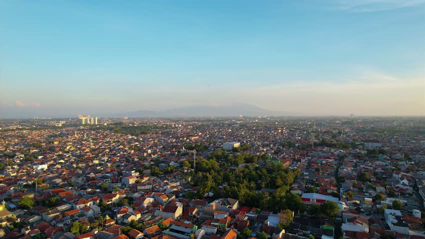 Jakarta, Indonesia - Aerial View  of a Residential Area in East Jakarta During Sunrise With Clear Sky, Urban Environment.