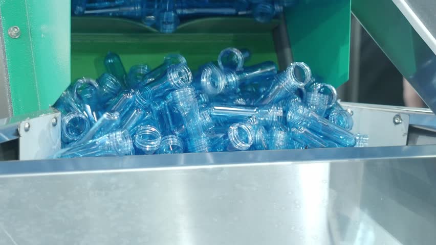 Demo making of PET or drinking water plastic bottle such as PET preform before automate heat blowing and shaping in molding machine and other process of making plastic bottles. Drinking water industry
