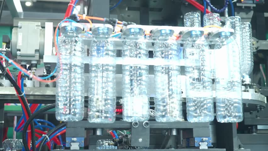 Demo making of PET or drinking water plastic bottle such as PET preform before automate heat blowing and shaping in molding machine and other process of making plastic bottles. Drinking water industry