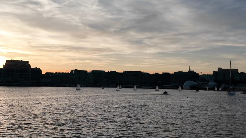 Sunset view of a boat floating on calm waters in Anzio, Italy, captured in 4K resolution Perfect for travel, tourism, and maritime themes, showcasing tranquil seascapes a peaceful coastal enviroment