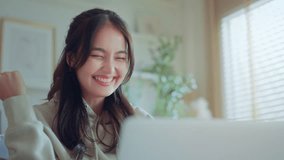 Closeup - Excited young asian woman winner looks at laptop celebrates online work at home on desk with successful. feeling surprised, Reads good news in email, Achieve target project.	 - Powered by Shutterstock - Get 15% off with code: PIKWIZARD15