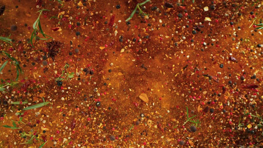 Super Slow Motion Shot Various Spices Mixture Exploding Towards Camera at 1000fps.