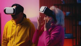 Excited senior couple in VR headsets explores a virtual reality simulation - Powered by Shutterstock - Get 15% off with code: PIKWIZARD15