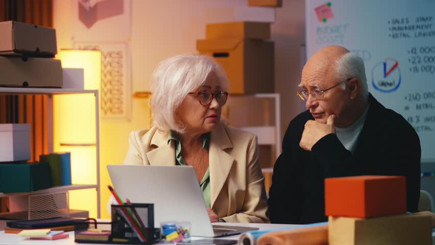 Elderly entrepreneur couple learning new computer program for small businesses - Powered by Shutterstock - Get 15% off with code: PIKWIZARD15