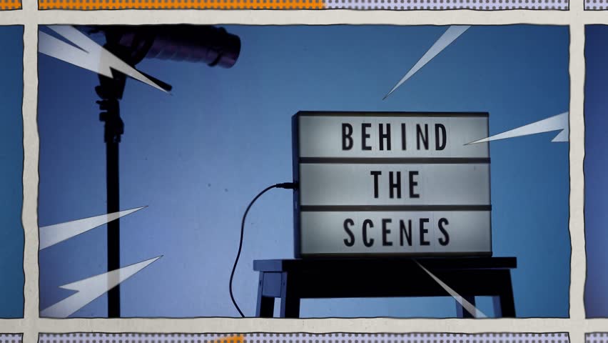 Behind the scene light box in front of vdo camera frame. Black text on white lightbox of word Behind the scenes. Prop for filmmaker movie or film studio. Footage for B roll video production making of.