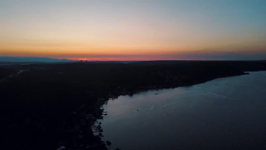 Aerial landscape of Lake Washington forest and mountains at sunset Bellevue suburb of Seattle WA USA