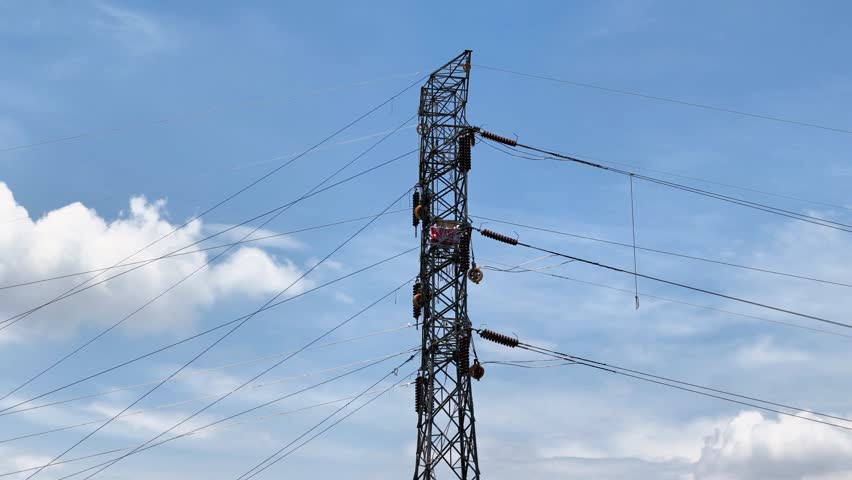High voltage transmission network lines in Indonesia. Double Circuit Steel pole transmission tower. Overhead transmission line conductor. Power pole