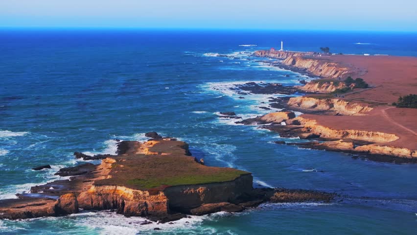 Point Arena Lighthouse islands Racas Sea Lion Rocks Cove California aerial drone Stornetta coastal Trail Mendocino coast vista point sunny daytime morning afternoon blue sky waves autumn circle left