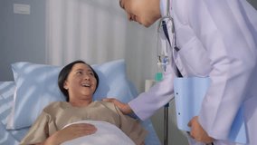 Asian male doctor examine patient woman lying on bed in recovery room. Professional mature medic man working to support, give diagnosis treatment to sick woman in health care clinic at hospital ward. - Powered by Shutterstock - Get 15% off with code: PIKWIZARD15