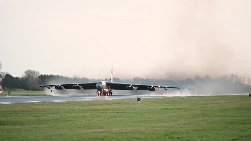 Two B-52s assigned to the 20th Expeditionary Bomb Squadron taxis the runway in at RAF Fairford, England.