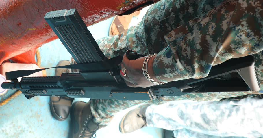 Coast Guard Hand With Gun on a boat