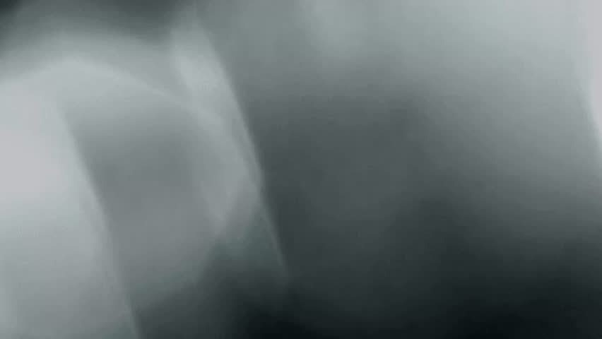 Thin wisps of white smoke floating on black background. Atmospheric concept