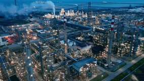 Aerial view of chimneys of power plant, an industrial district. Modern large thermal power plant - Powered by Shutterstock - Get 15% off with code: PIKWIZARD15