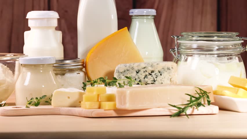Various dairy items displayed on a wooden surface