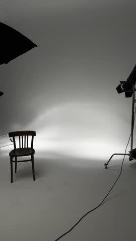 Cyclorama in the photo studio and light flashes for portrait photography